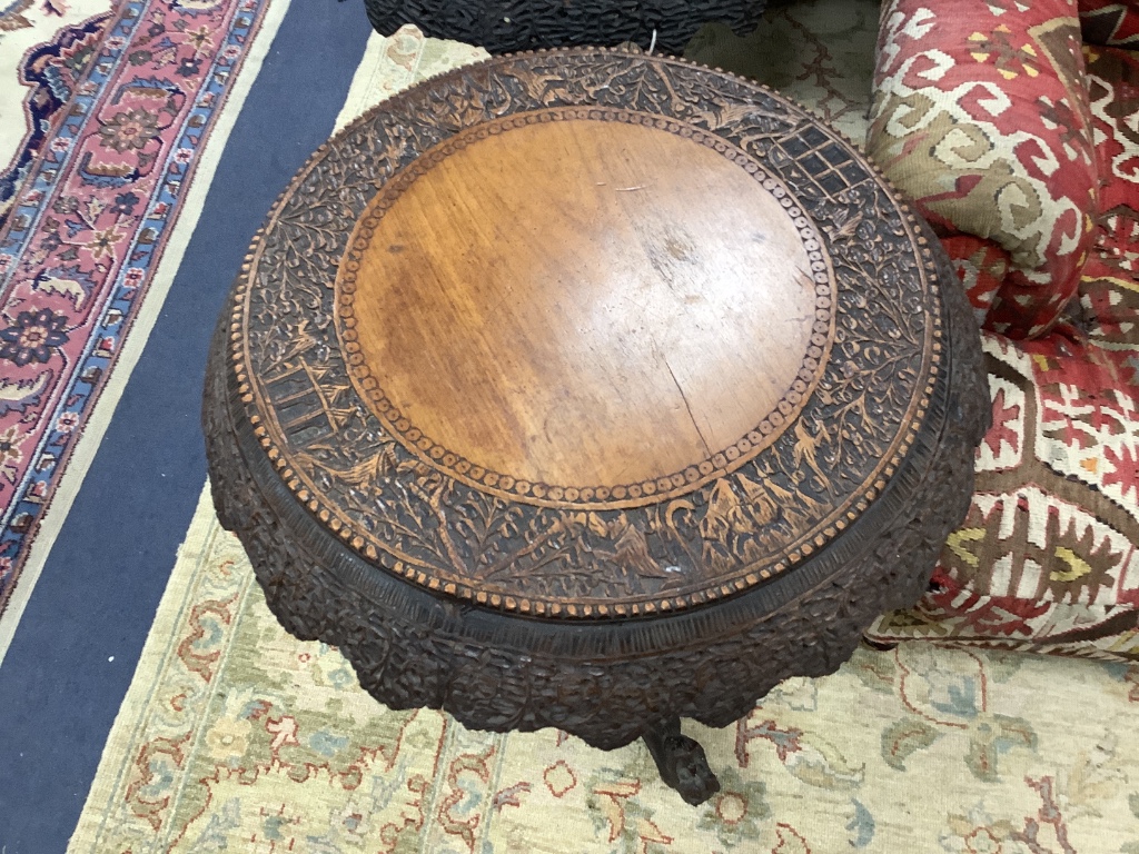 A near pair of 19th century Indian padouk tripod tables, 62cm diameter, height 70cm